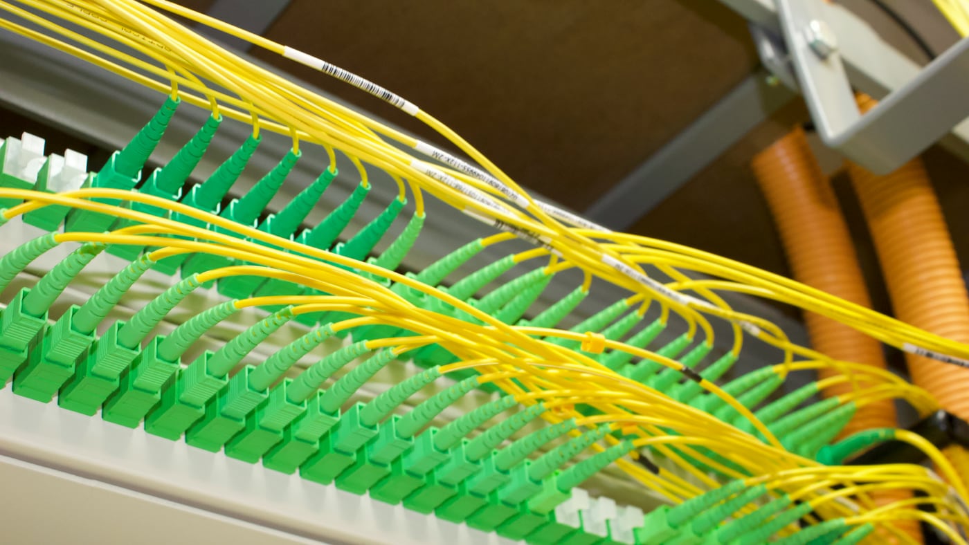 Terminated fibre panel with green connectors and yellow fibre